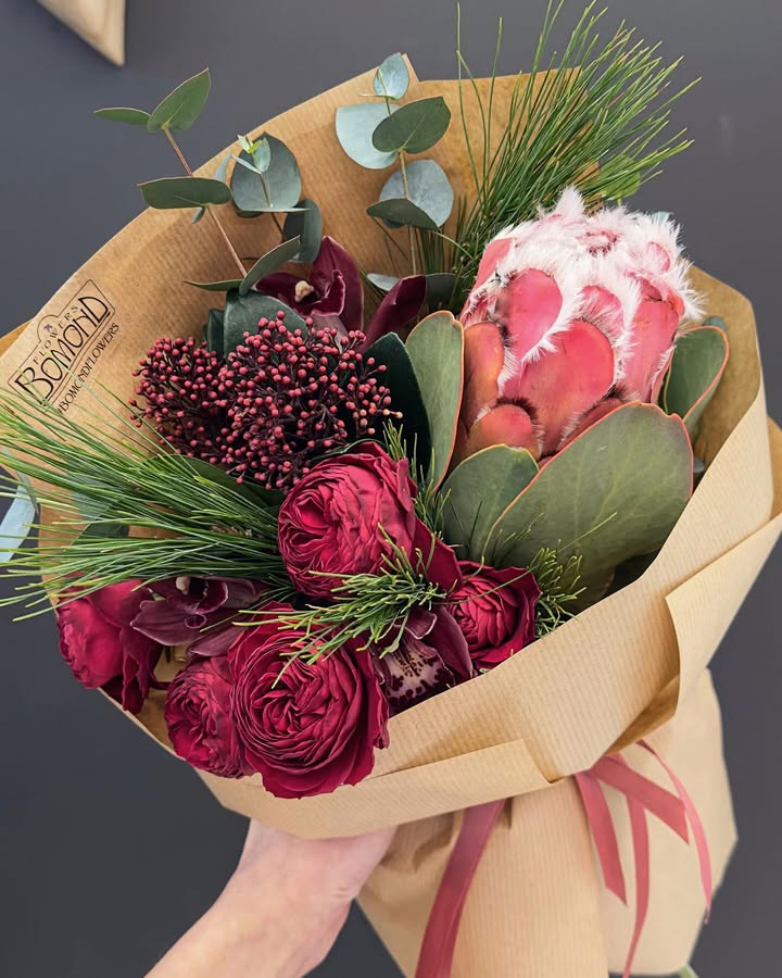 Bouquet with Protea and Burgundy Flowers in Kraft Wrap