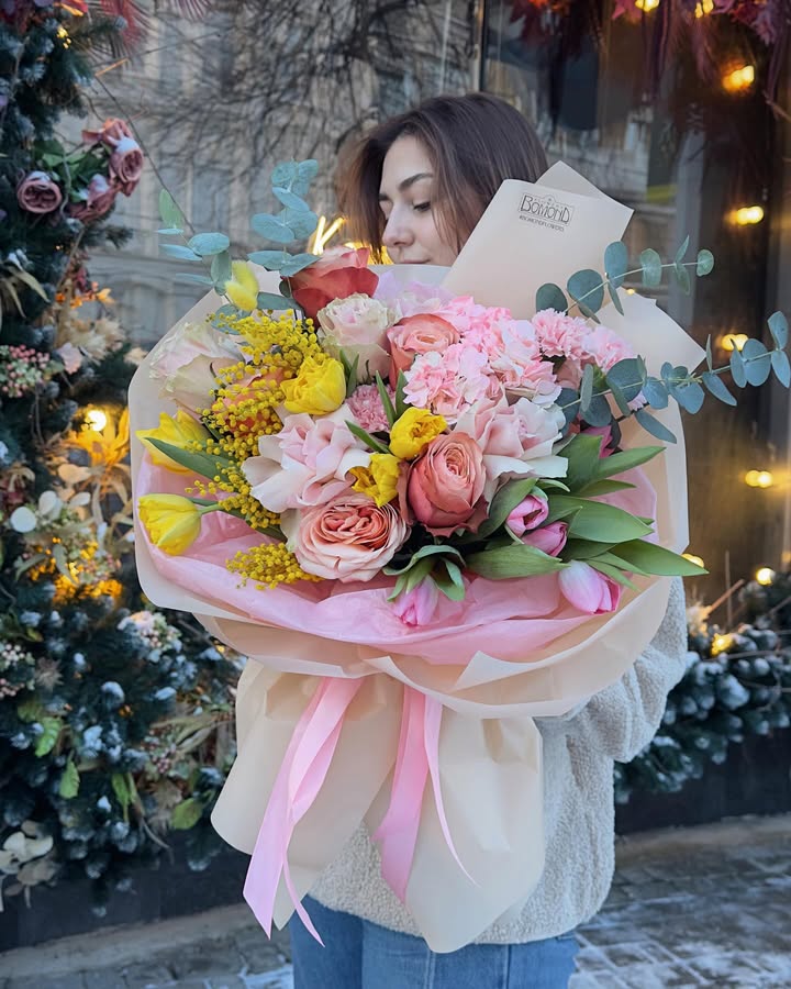 Spring bouquet with roses, tulips, and mimosa