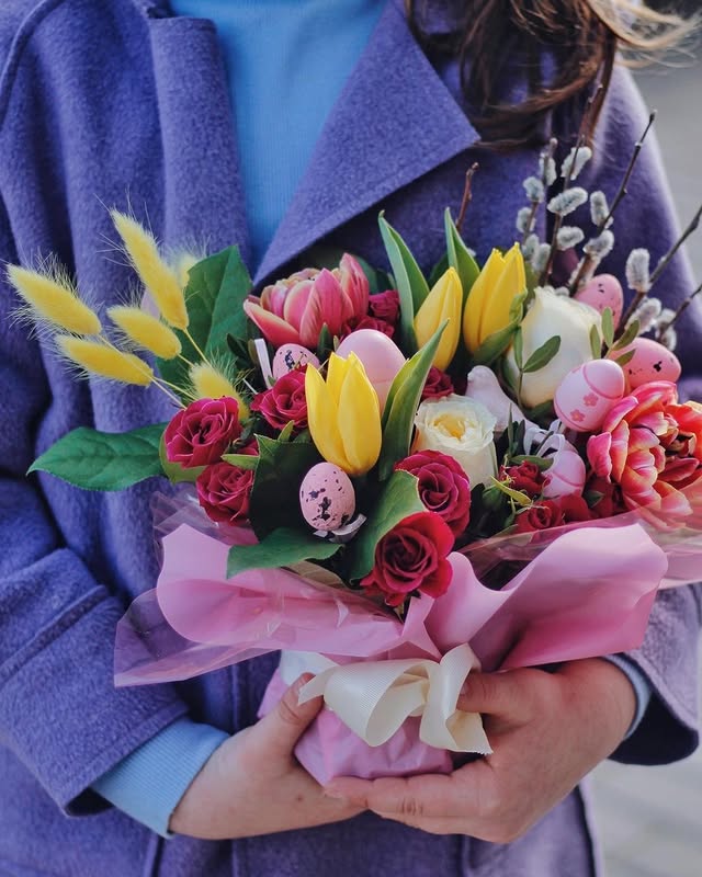 Spring bouquet with tulips, roses and decorative eggs