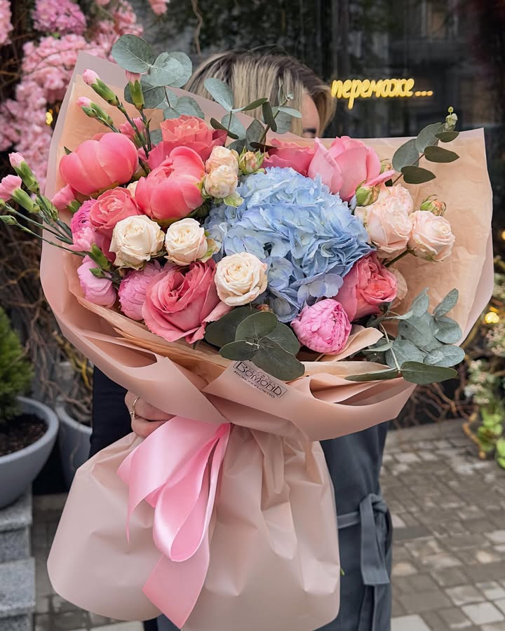 Bouquet of roses, peonies and hydrangea with eucalyptus