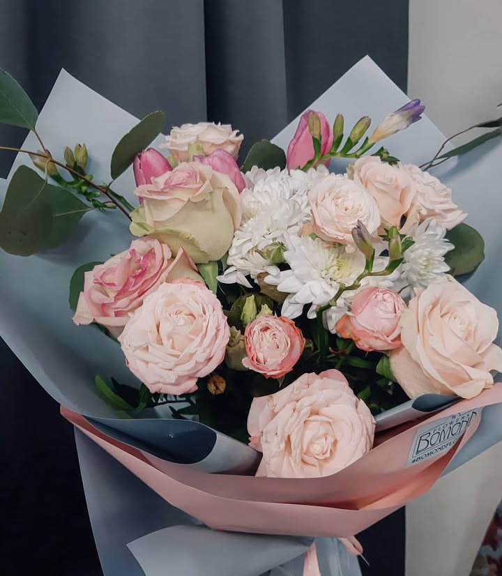 Bouquet of soft pink roses and chrysanthemums with eucalyptus
