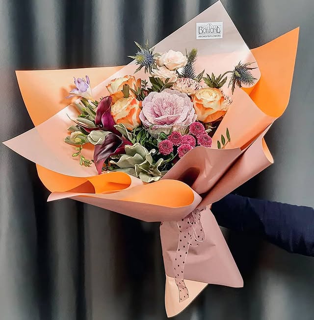 Bouquet with Roses and Decorative Cabbage in Peach Wrapping