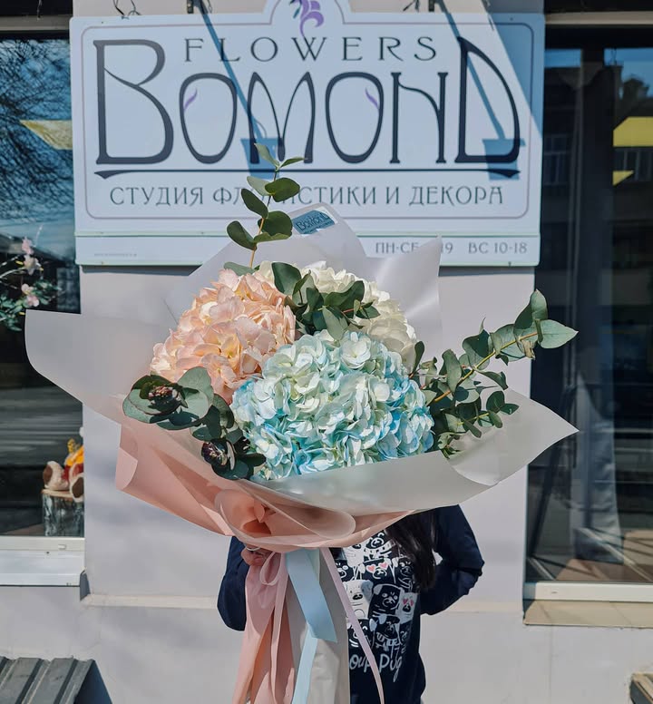 Bouquet of multicolored hydrangeas with eucalyptus