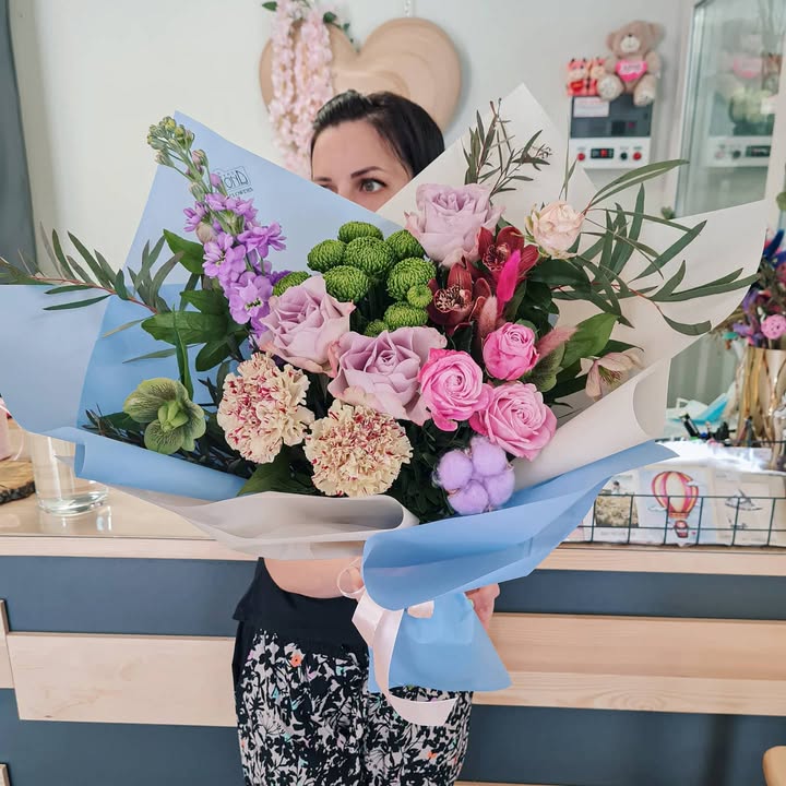 Bright Bouquet of Roses and Carnations in Blue Wrapping