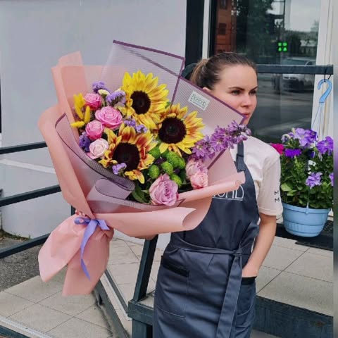Summer bouquet with sunflowers and roses
