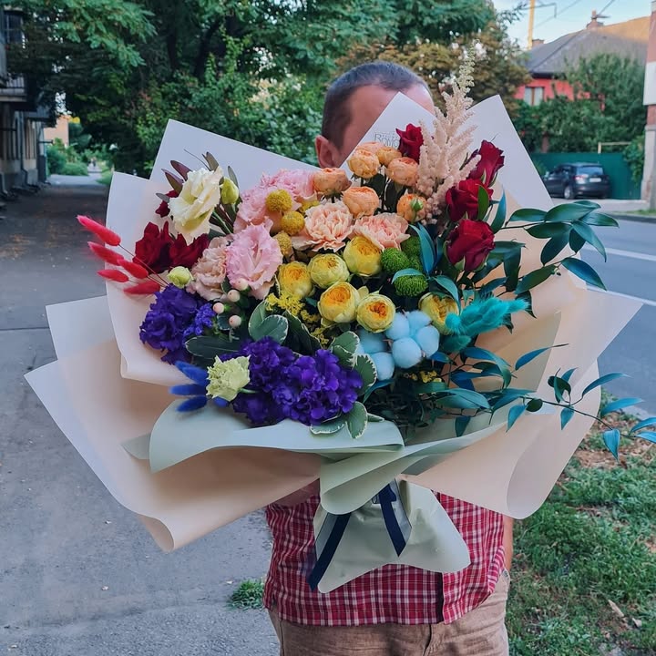 Bright festive bouquet with multicolored flowers