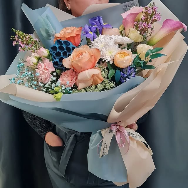 Unique Designer Bouquet with Roses and Irises in Stylish Wrapping