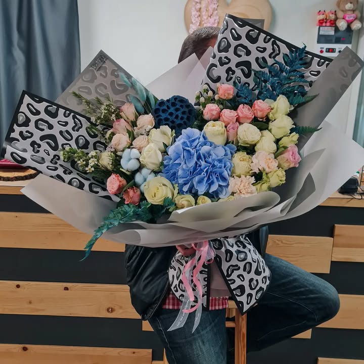 Giant bouquet with blue hydrangea and roses