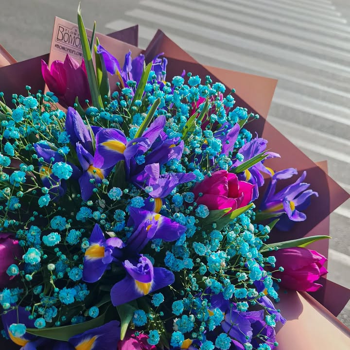 Bouquet with Purple Irises and Bright Blue Gypsophila