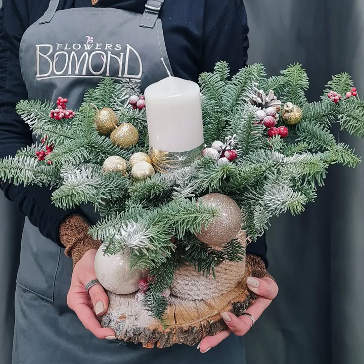 New Year Composition of Fresh Fir with White Candle and Christmas Baubles