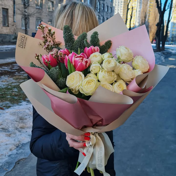 Spring bouquet with peony white roses and pink tulips