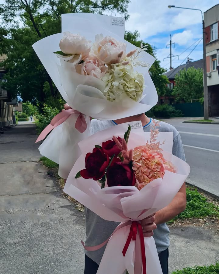 Bouquet of delicate light pink peonies and white hydrangeas