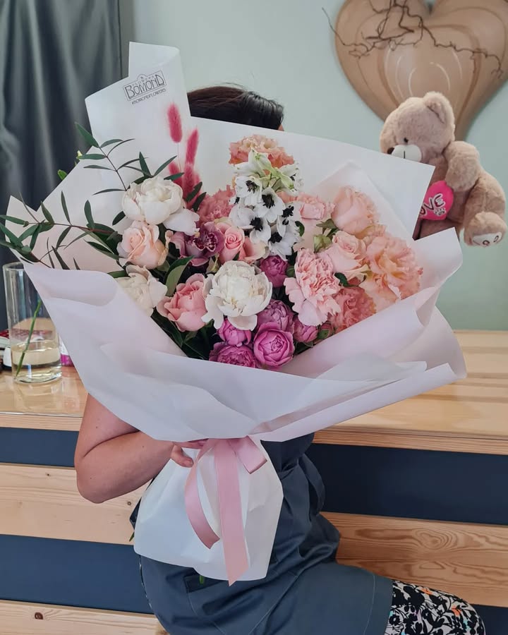 Bouquet of peonies, roses and anemones in soft pastel tones