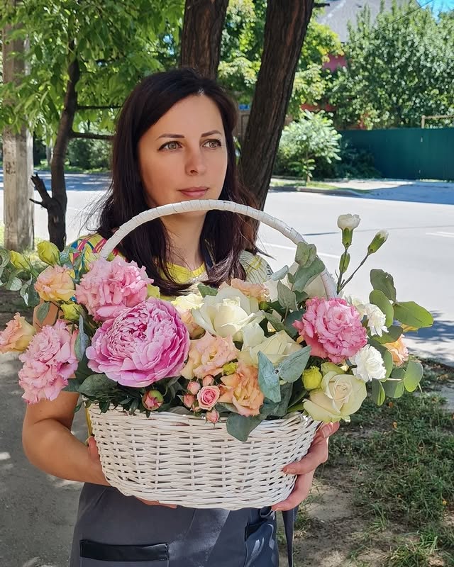 Basket with delicate pink and white flowers