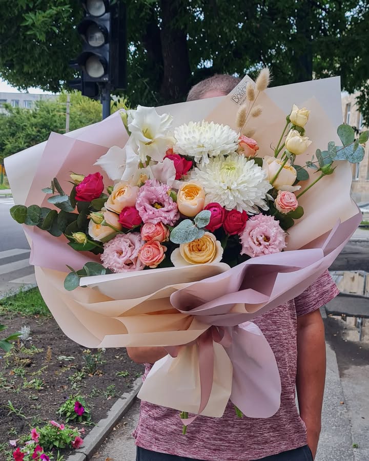 Fresh floral bouquet with roses, chrysanthemums, and eucalyptus