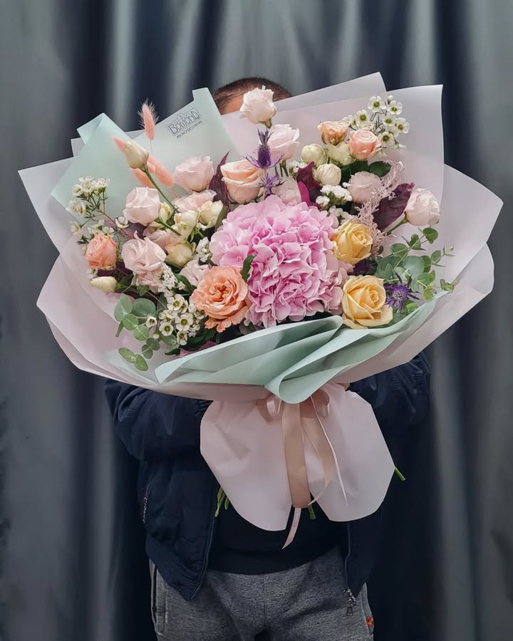Delicate bouquet with pink hydrangea and pastel roses