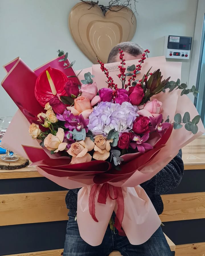 Large luxurious bouquet of roses, hydrangea, and exotic flowers
