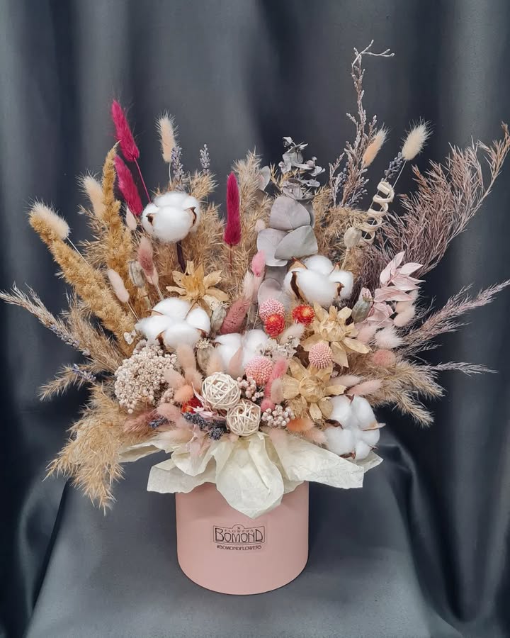 Interior dried flower arrangement in soft tones with cotton