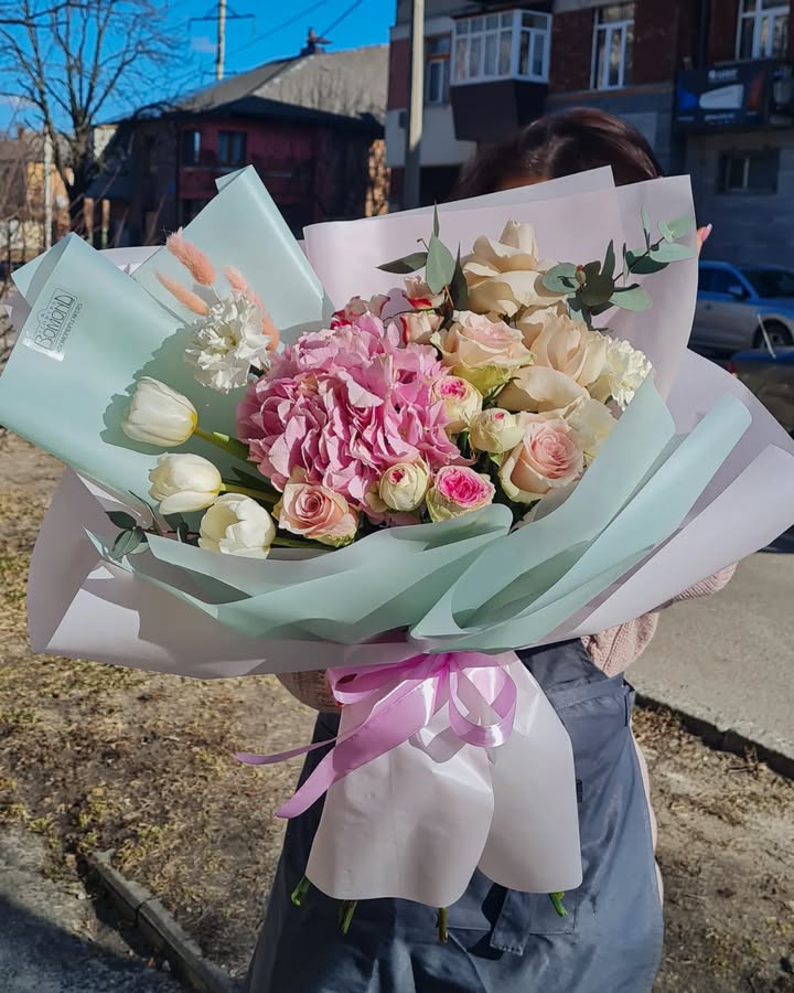 Spring bouquet with hydrangea, roses and tulips