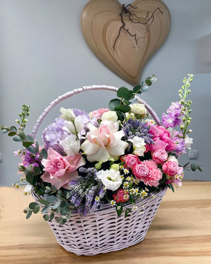 Basket bouquet with pink and lavender flowers
