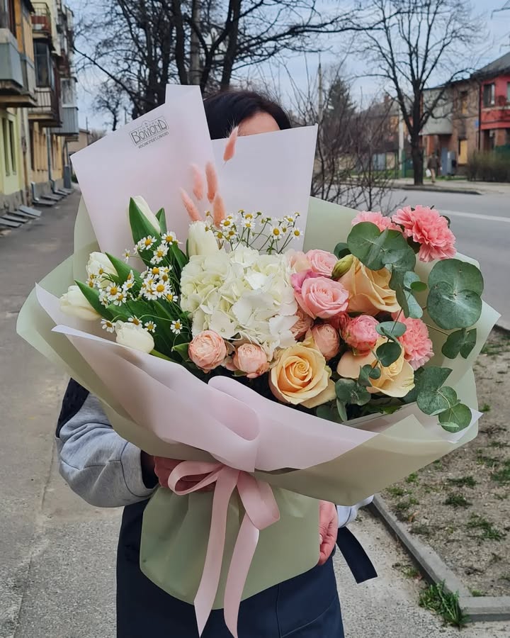 Bouquet of roses, hydrangeas and tulips in pastel tones