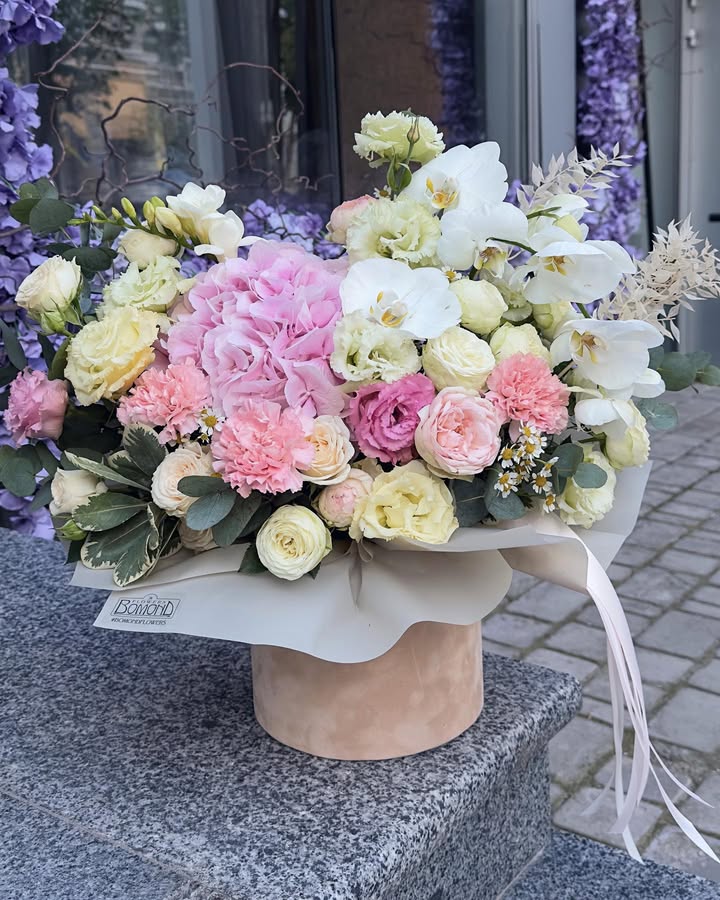 Delicate bouquet in velvet box with hydrangea and orchids