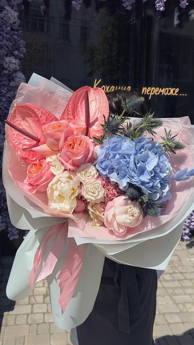 Bouquet of roses, peonies and hydrangea in soft pastel colors