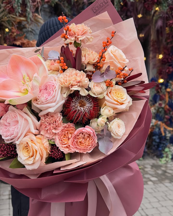 Bouquet of Pastel Roses and Carnations with Decorative Berries