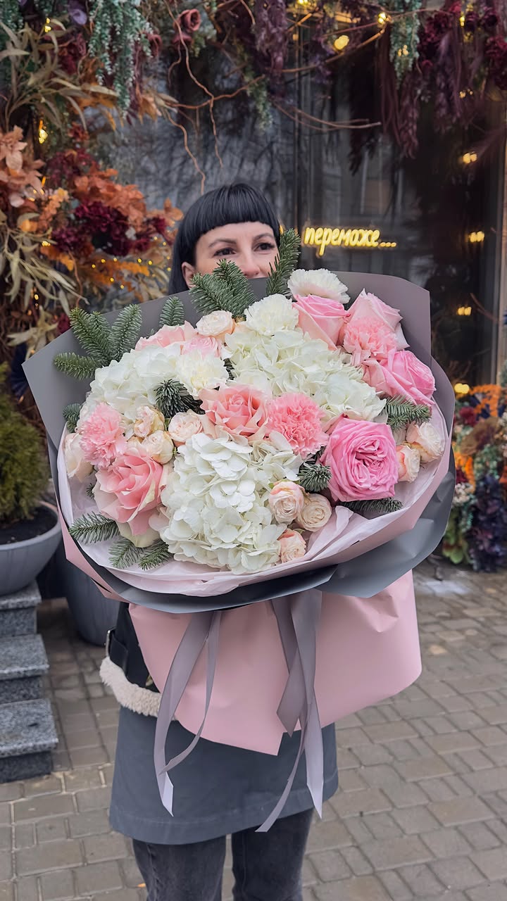 Delicate New Year bouquet with white hydrangea and pink roses