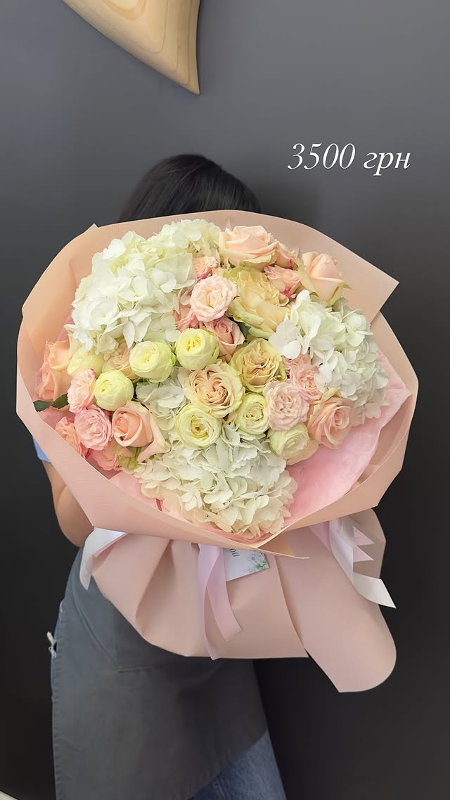 Large bouquet with white hydrangeas and cream roses
