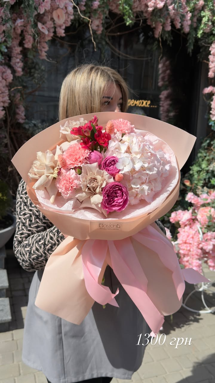 Bouquet of delicate pink and white flowers with hydrangea and peony-like rose
