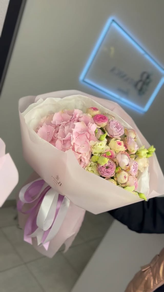 Bouquet with hydrangea and ranunculus in soft pink tones