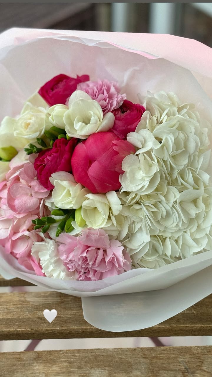 Bouquet of white hydrangea, pink carnations and red peonies