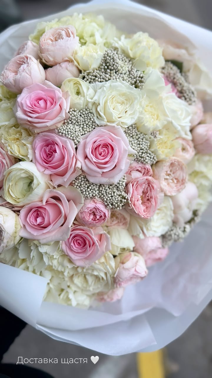 Bouquet of pink and white garden roses and peony roses
